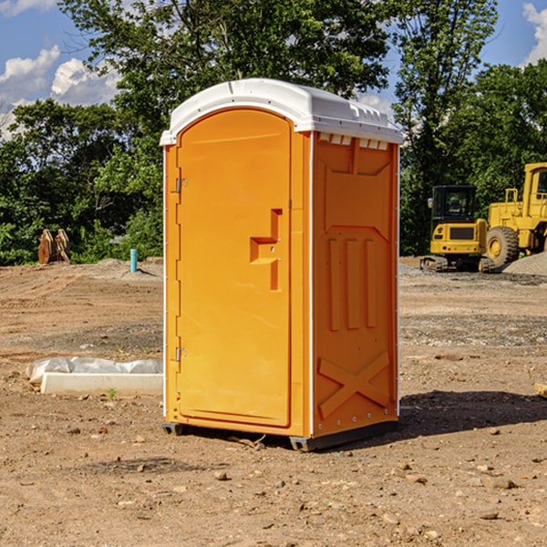 what is the cost difference between standard and deluxe portable restroom rentals in Machias